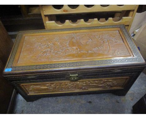 A mid 20th century Oriental camphor chest with internal luggage tray and a small quantity of vintage linen 