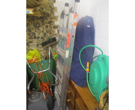 A large mixed lot to include a wheelbarrow, a ladder, gardening tools, CD rack and other items 
