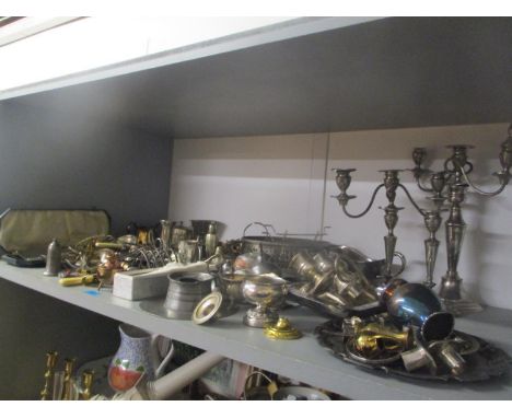 A selection of silver plate, brass and pewter to include candelabras, an inkwell, flatware, fish servers and other items 