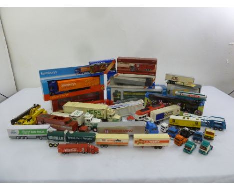 A quantity of diecast trucks and transporters to include Matchbox and Corgi, some boxed