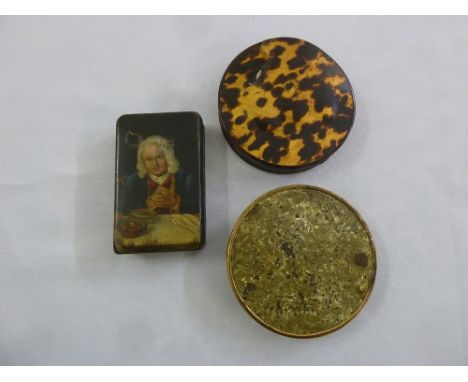 A late 18th century rectangular papier mache snuff box with a painted image of a gentleman at a table, a tortoiseshell circul