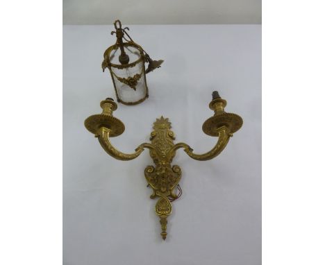 An early 20th century gilt metal and cut glass hall light and a two branch gilt metal wall light
