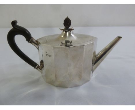A Victorian silver teapot, panel form with fruitwood carved pineapple finial and fruitwood handle, London 1896