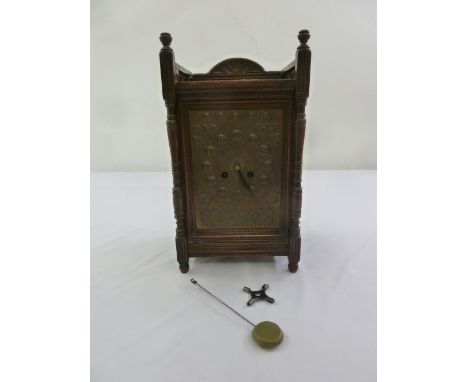 An early 20th century oak cased mantle clock two train movement, to include key and pendulum