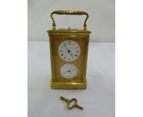 A brass repeating carriage clock with barometer to include key