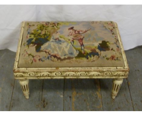 A Victorian rectangular foot stool with a tapestry inset of a man playing a musical instrument to a lady