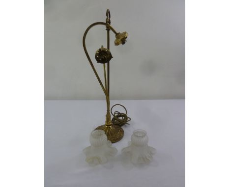 An Art Nouveau style brass table lamp with two frosted glass shades A/F