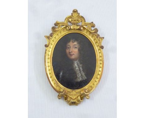 An 18th century framed miniature portrait of a gentleman by Rigaud, 15 x 9.5cm