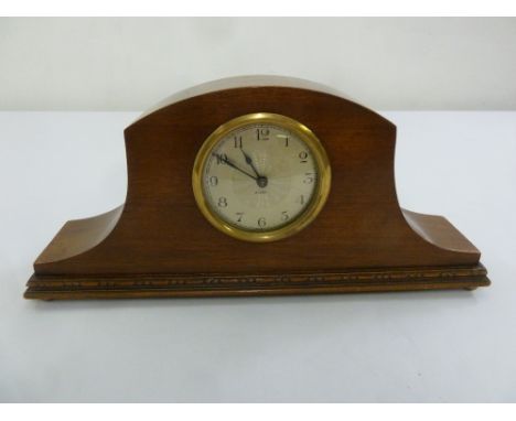 An Edwardian eight day mahogany mantle clock, silvered dial with Arabic numerals