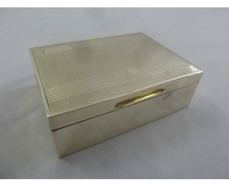 A silver engine turned rectangular cigarette box, Birmingham 1954