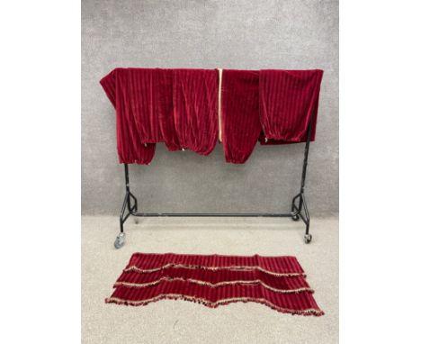 A set of seven hessian backed burgundy velvet pleated curtains with a matching pelmet. L.264 W.120cm (Each curtain) 