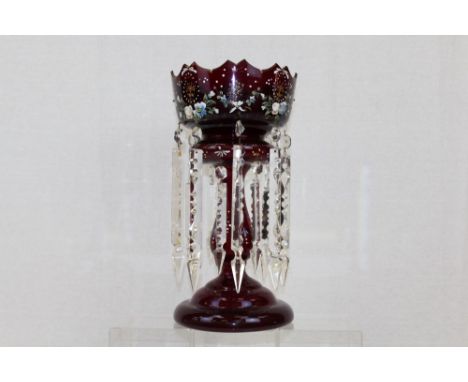 Large and impressive late Victorian ruby glass table lustre with gilt and enamel floral decoration and suspended prismatic dr