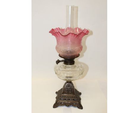 Victorian oil lamp with Wright & Butler, Birmingham, burner and glass reservoir, flared cranberry glass shade and clear glass