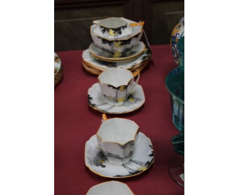 Art Deco Shelley tea set decorated with stylised sun and landscape scene - comprising milk, sugar, six tea plates, six saucer