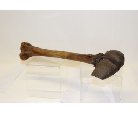 Native American stone axe with bone handle