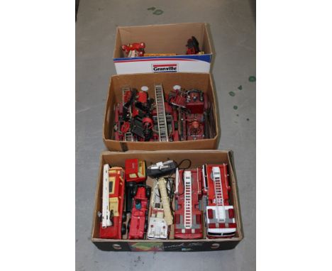 Three boxes of large scale plastic and tinplate Fire Engines