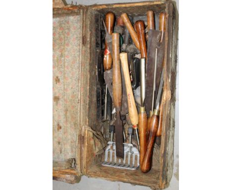 Lot of woodworking tools in vintage dome top trunk 