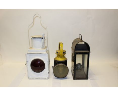 British Rail black and yellow oil hand signal lamp, marked - B. R., together with a white painted guard or locomotive tail la