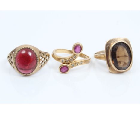 Gold (18ct) diamond and ruby crossover ring and two gold (9ct) dress rings (3)