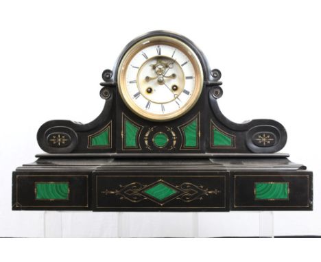 Late Victorian mantel clock with French eight day movement striking on a gong and white enamel dial with visible escapement, 