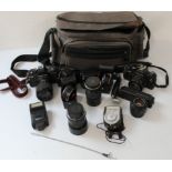 A Collection of Praktika cameras and attachments, to include a Praktika BMS electronic camera with