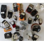 Assorted flash guns, exposure meter and wind meter. Various flash guns including Prinz, Olympus,