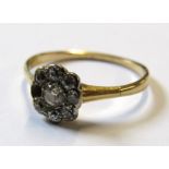 Tested as 18ct gold diamond daisy ring (missing 1 diamond) - ring size M -  1.76g