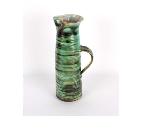 Llangollen Pottery Tall Water Jug or Pitcher Ridged earthenware with shaped and pinched rim, external mottled green and inter