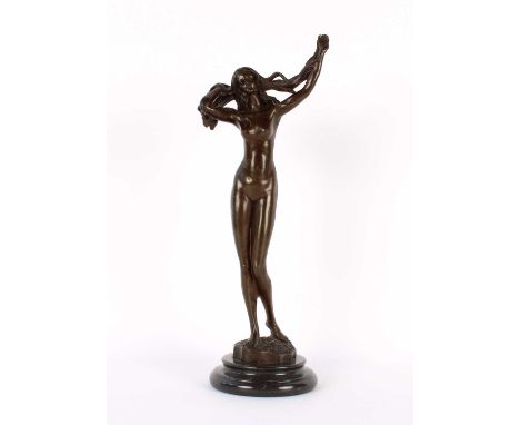 Bronze Female Nude After Jean Patou 20th century, bearing impressed signature and raised on a stepped circular black hardston
