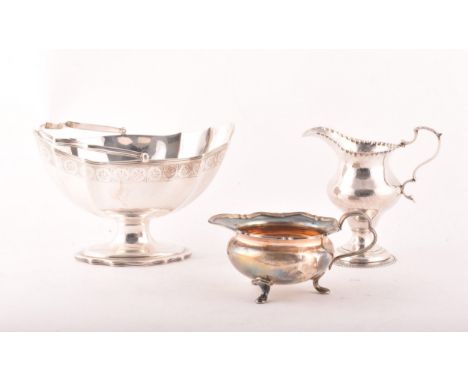 A George III silver cream jug hallmarked London 1778, a George III sugar bowl hallmarked for London 1793, and a silver milk j