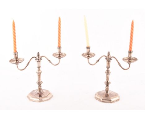 A pair of Elizabeth II silver small candelabras, hallmarked for London 1968 by&nbsp;John Henry Odell, 18cm high x 19cm wide. 