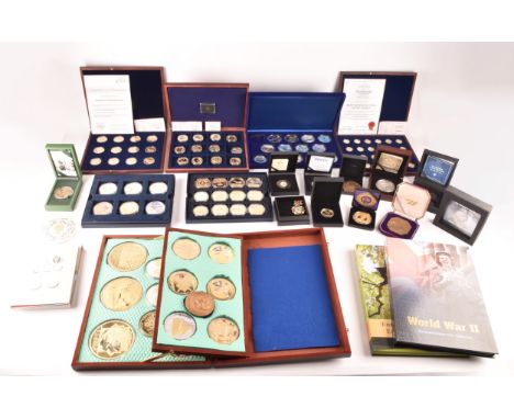 A collection of gold plated collectors coins, including head of the house of Windsor, Westminster, St George and the Dragon, 