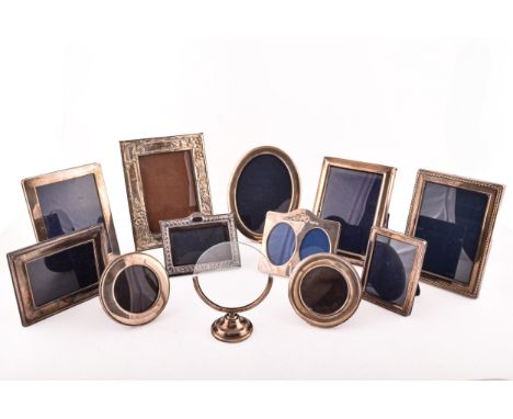 A collection of silver photo frames, including an Art Nouveau style silver frame, with import marks for London 1985, 18 x 14c