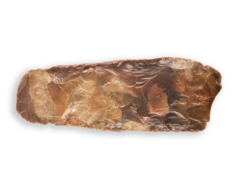 A Stone Age Neolithic carved and chipped expanding form flint axe head, 20.5 cm long.