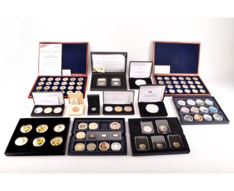 A collection of silver commemorative coin sets including: The 150 Anniversary of Winston Churchill fine silver proof 5oz coin