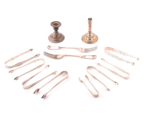 A large collection of silver sugar tongs of various maker's, dates and sizes, a pair of Georgian dinner knives, fiddle patter