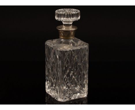 A silver mounted cut crystal glass whisky decanter and stopper, with silver mounted collar, hallmarked Birmingham 1974 by&nbs
