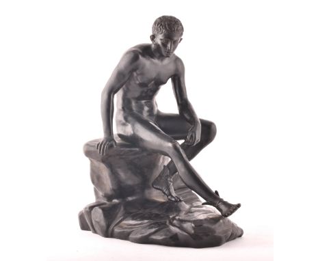 A bronze figure of seated Hermes, based on the life-size bronze Roman statue found at the Villa of the Papyri in Herculaneum 