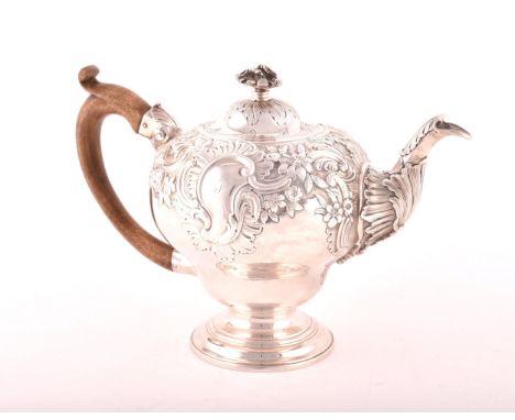 A George III silver teapot, hallmarked for London 1769, possibly by&nbsp;Charles Wright, intricate foliate decoration, 17cm h