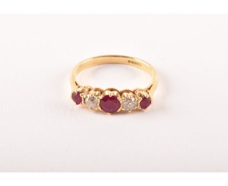 An 18ct yellow gold, diamond, and ruby ring, set with three mixed round-cut rubies, the largest measuring approximately 4.5 m