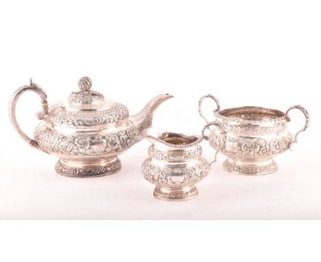 A William IV three-piece Irish silver tea set, including a teapot, 16.5cm height x 29.5cm width, a sugar bowl, 10cm height x 