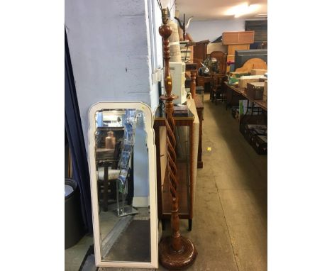 A twisted wooden standard lamp