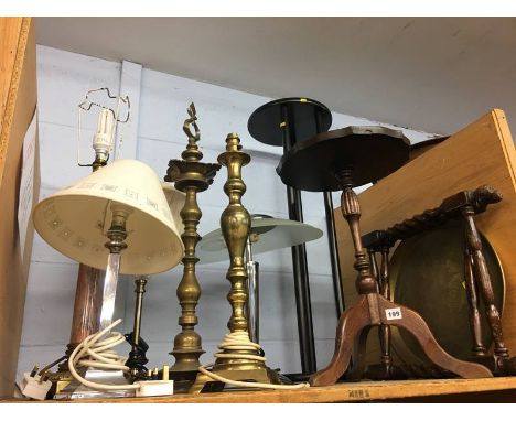 Brass folding table and a shelf of lamps