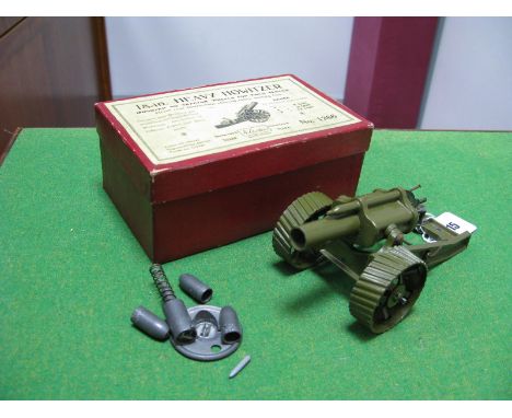 A Britains Mid XX Century 18inches Heavy Howitzer, mounted on tractor wheels, olive finish. Appears unbroken, with shells. Ap