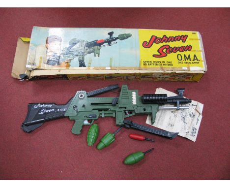 A Boxed (Circa 1964) Johnny Seven O.M.A (One Man Army) Toy Gun, #6025 distributed by Deluxe Topper, seven guns in one, grenad