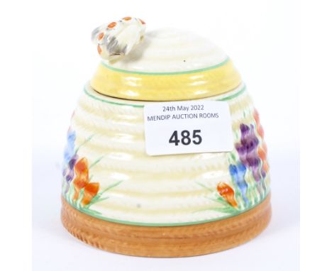 A Clarice Cliff Crocus pattern honey pot. H10cm  Condition Report:  Small chip by the spoon hole