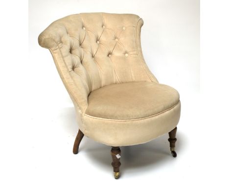 An Edwardian style button back bedroom chair. On turned front supports, H73cm