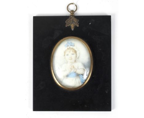 A 19th century minature portrait on ivory of a child in a white dress with blue sash Condition Report: Image is a print