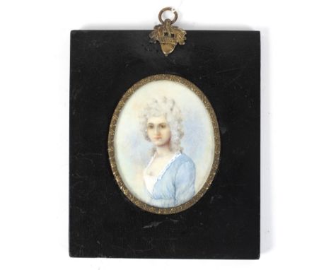 A 19th century minature portrait on ivory depicting a lady in a blue dress