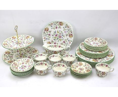A part Minton Haddon Hall dinner service. Decorated with flowers within green rims, including plates, cups, saucers, sauce bo